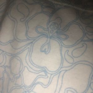 A Reebok XS women’s jacket with a flower pattern.